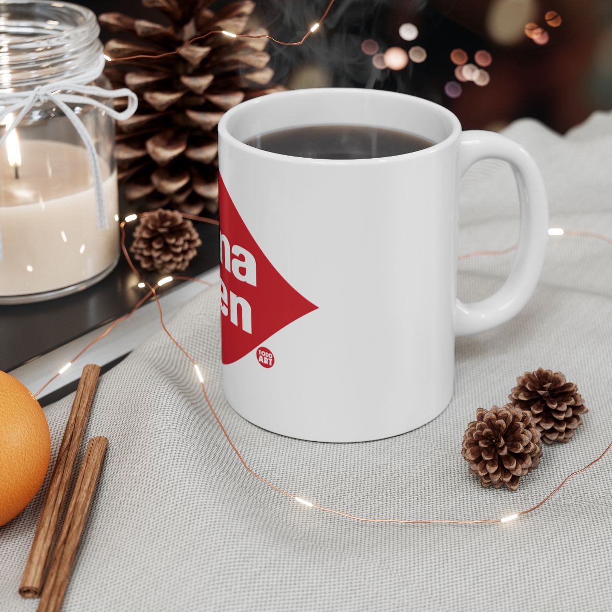 Festive Holiday Mug with Cozy Candle and Pine Cones