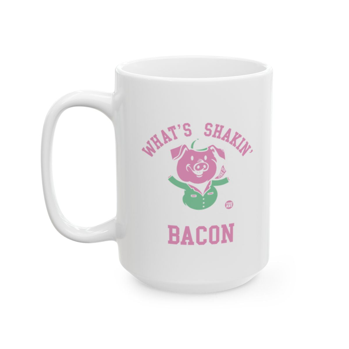 White ceramic mug featuring a pig illustration and the words “What’s Shakin’ Bacon,” designed by Todd Art