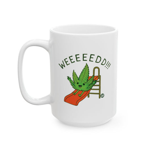 White ceramic coffee mug with a cartoon cannabis leaf sliding down a playground slide and the text “WEEEEEED!!!”