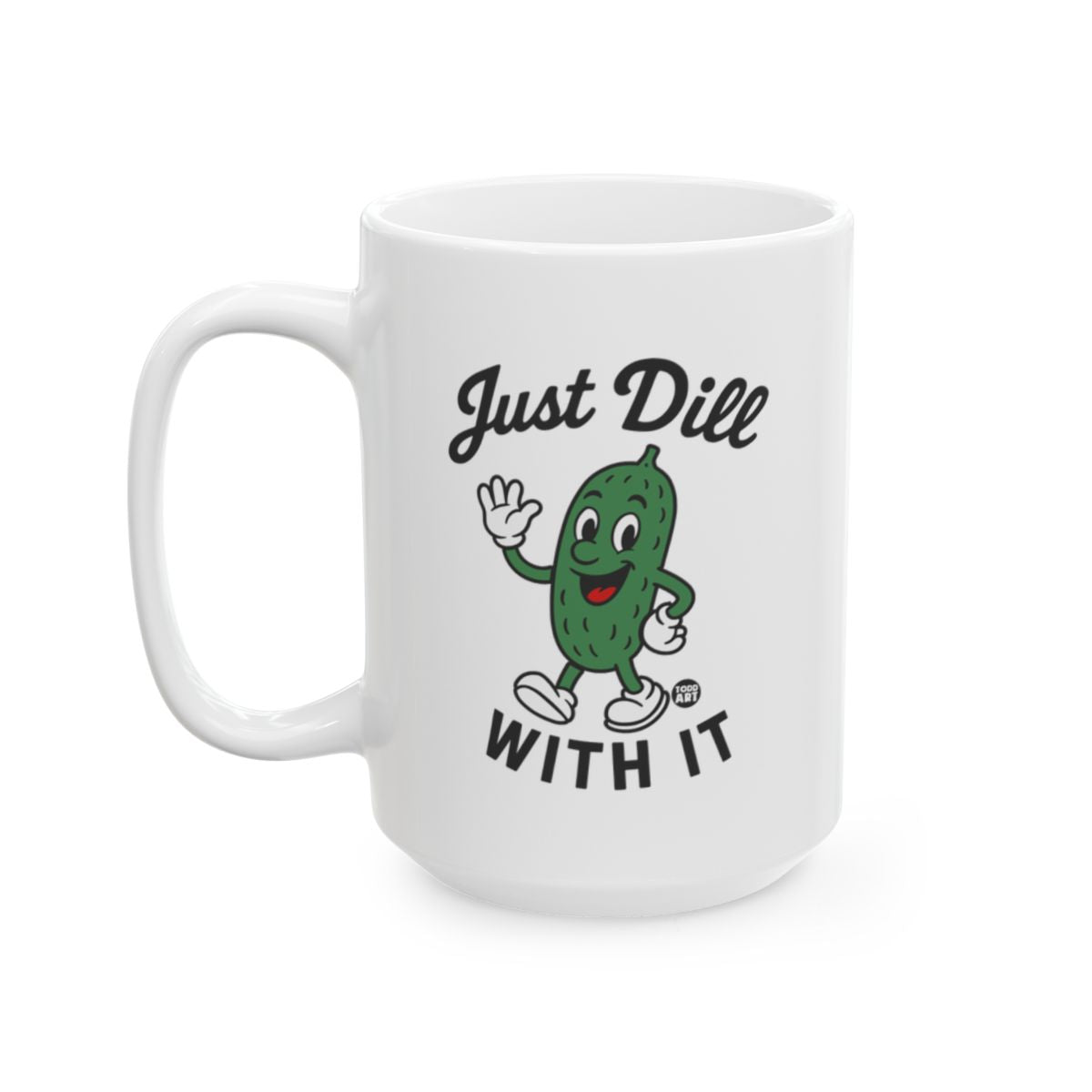 White ceramic mug featuring a cartoon pickle waving with the words “Just Dill With It,” designed by Todd Art